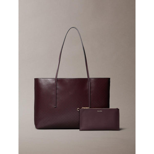 Calvin Klein
COATED EMBLEM - Handbag - fudge aop