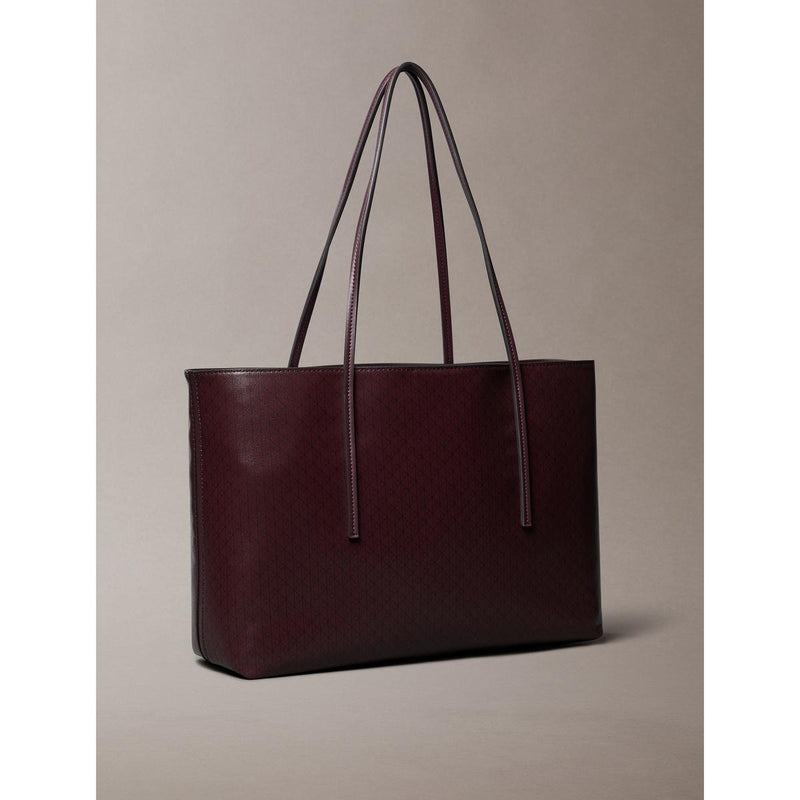 Calvin Klein
COATED EMBLEM - Handbag - fudge aop